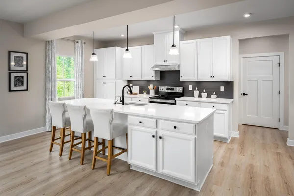a living room with furniture a wooden floor and next to a window