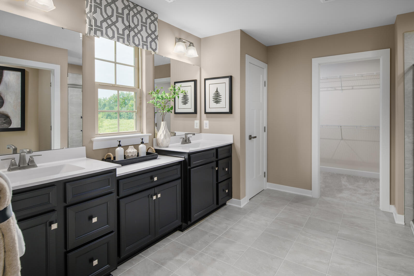 7215 Fairway Ridge Road Salem, VA 24153 - Photo 10 of 79 a spacious bathroom with a double vanity sink a large mirror and a bathtub