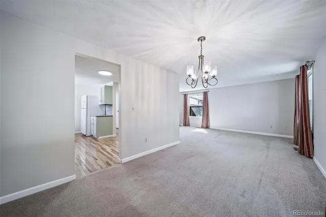 a view of a chandelier and a chandelier in big room