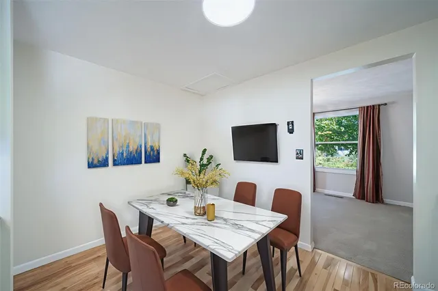 a work room with furniture and a flat screen tv