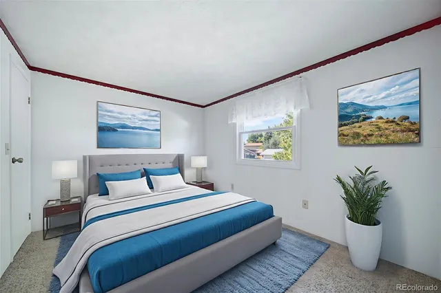 a bedroom with a large bed and a potted plant