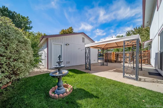 a backyard of a house with lots of green space