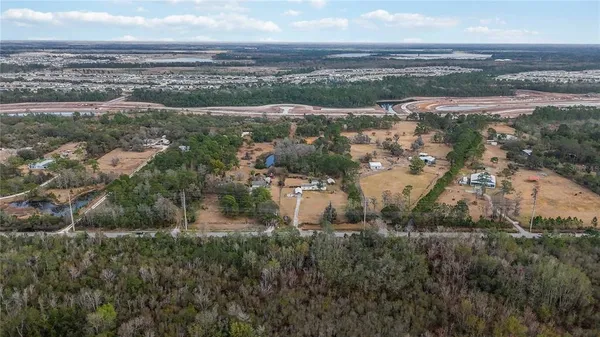 an aerial view of residential building and ocean view