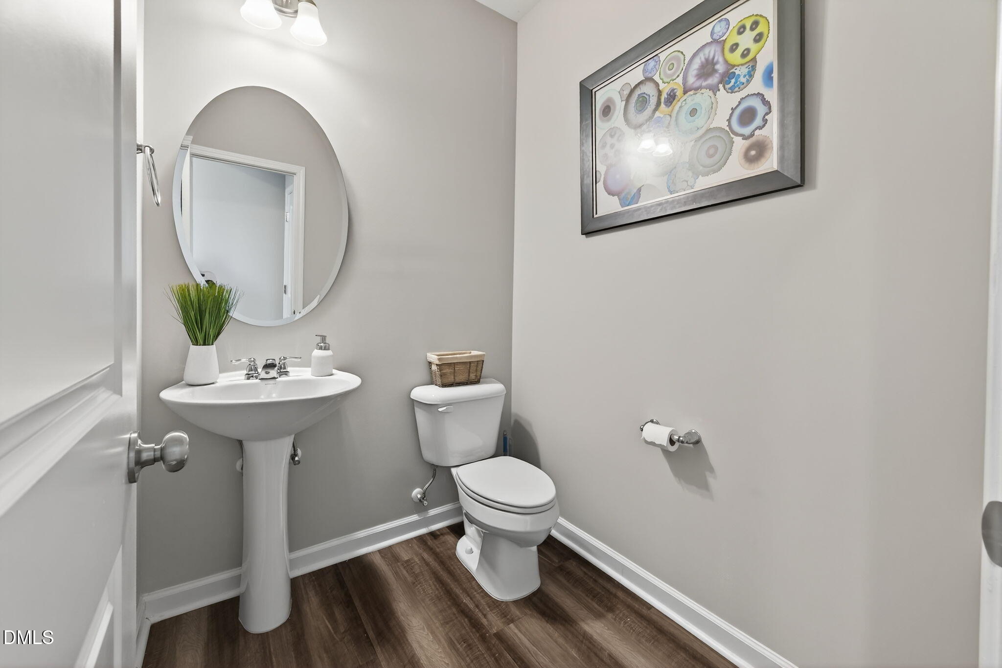 1063 Shoreside Drive Durham, NC 27713 - Photo 20 of 35 a bathroom with a toilet a sink and a mirror