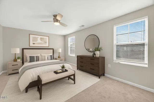 a bedroom with a bed and a dresser