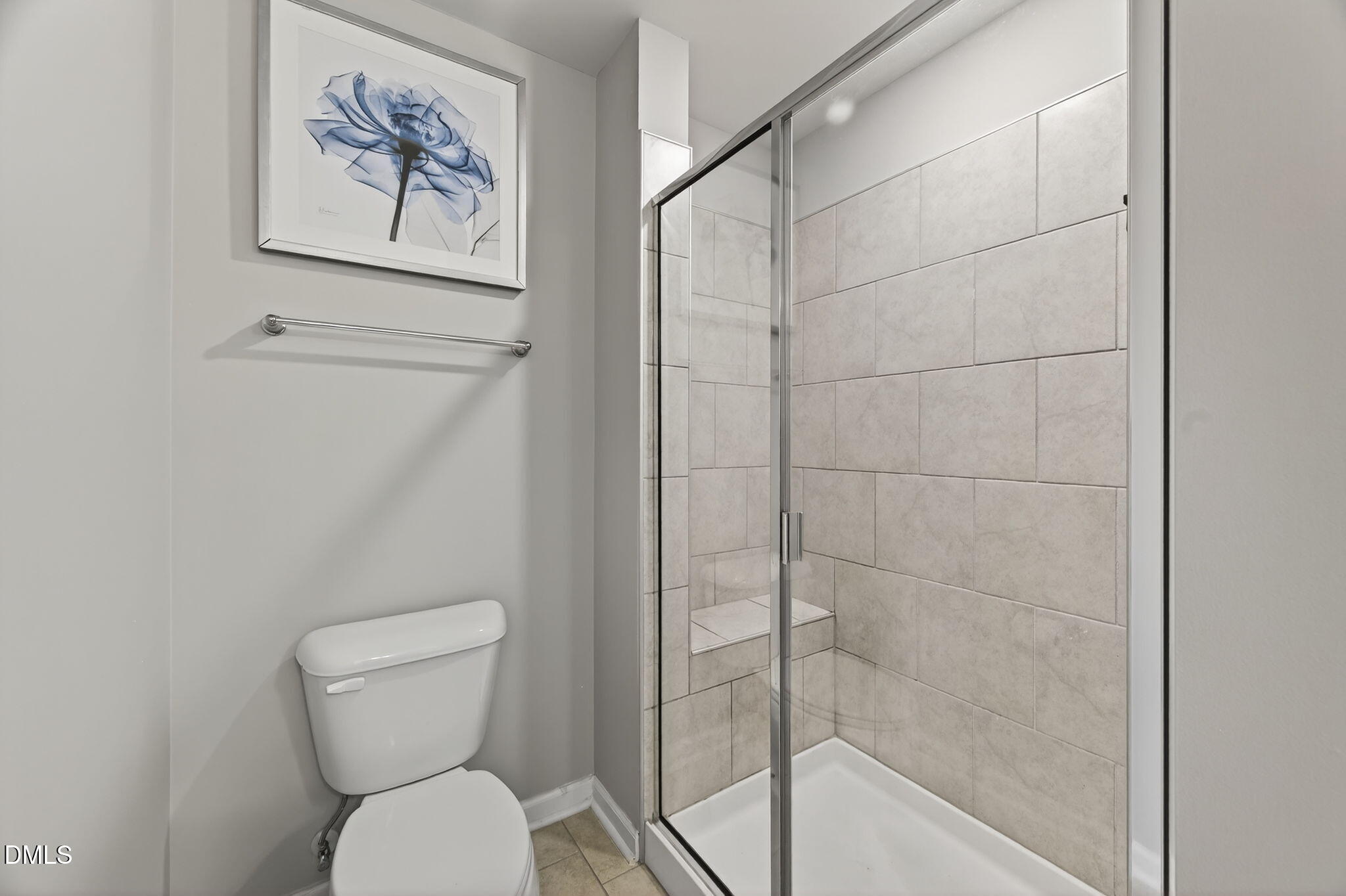1063 Shoreside Drive Durham, NC 27713 - Photo 25 of 35 a bathroom with a toilet and a shower
