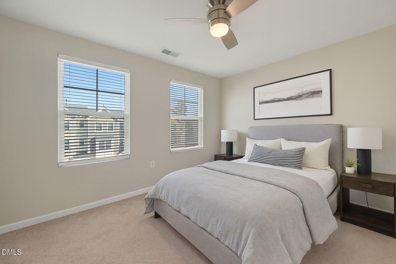 1063 Shoreside Drive Durham, NC 27713 - Photo 26 of 35 a bedroom with a bed and a window