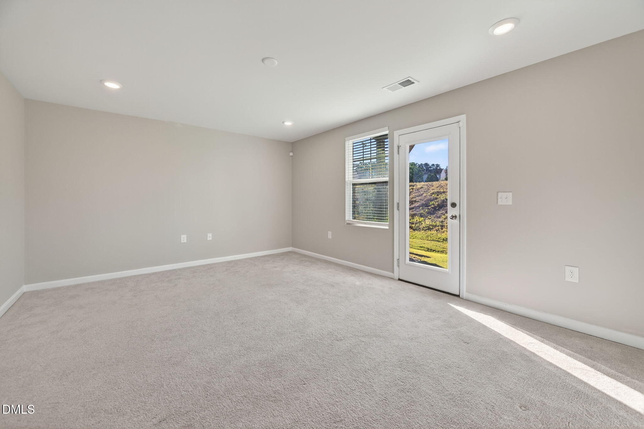 1063 Shoreside Drive Durham, NC 27713 - Photo 6 of 35 an empty room with windows