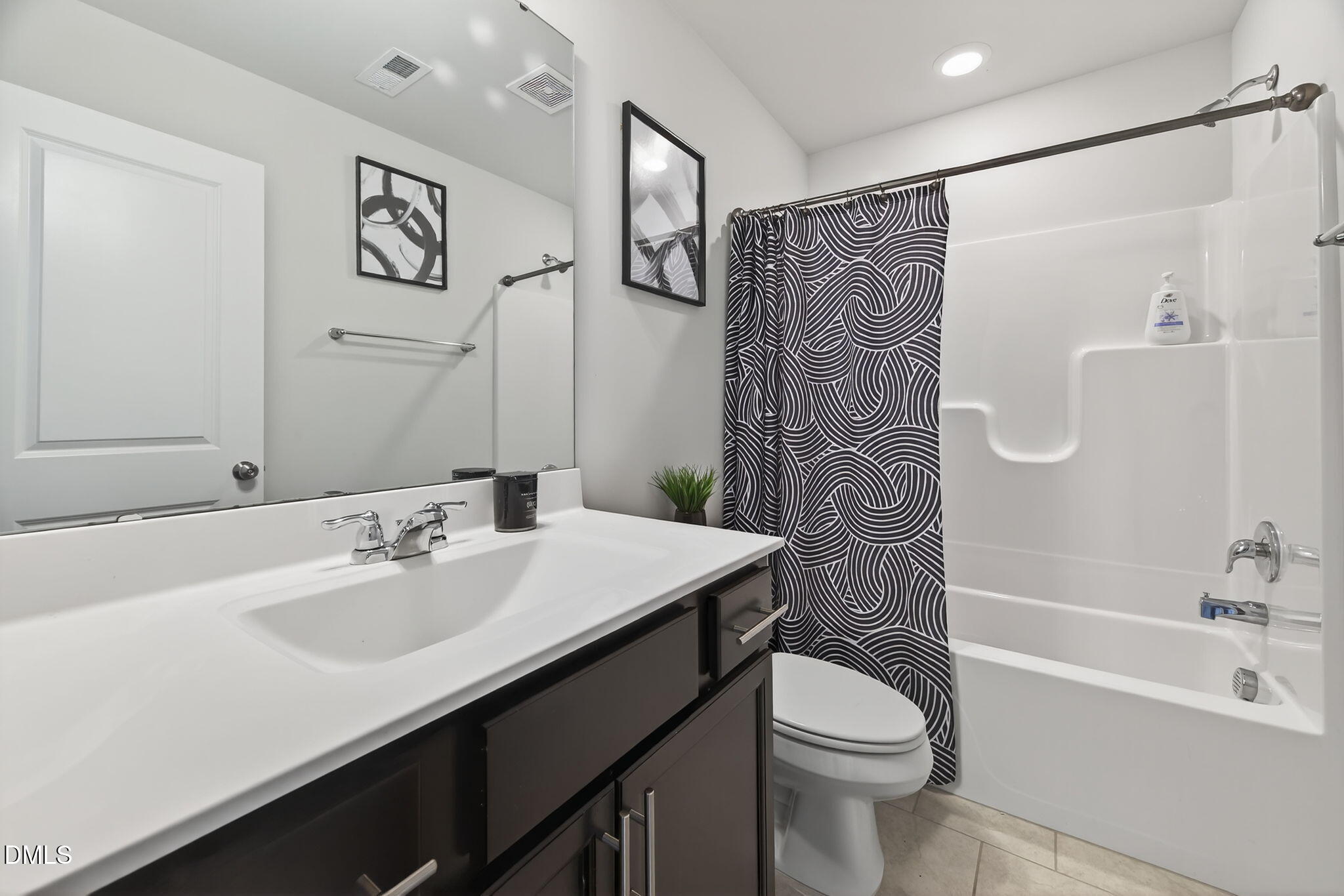 1063 Shoreside Drive Durham, NC 27713 - Photo 8 of 35 a bathroom with a sink a toilet and shower