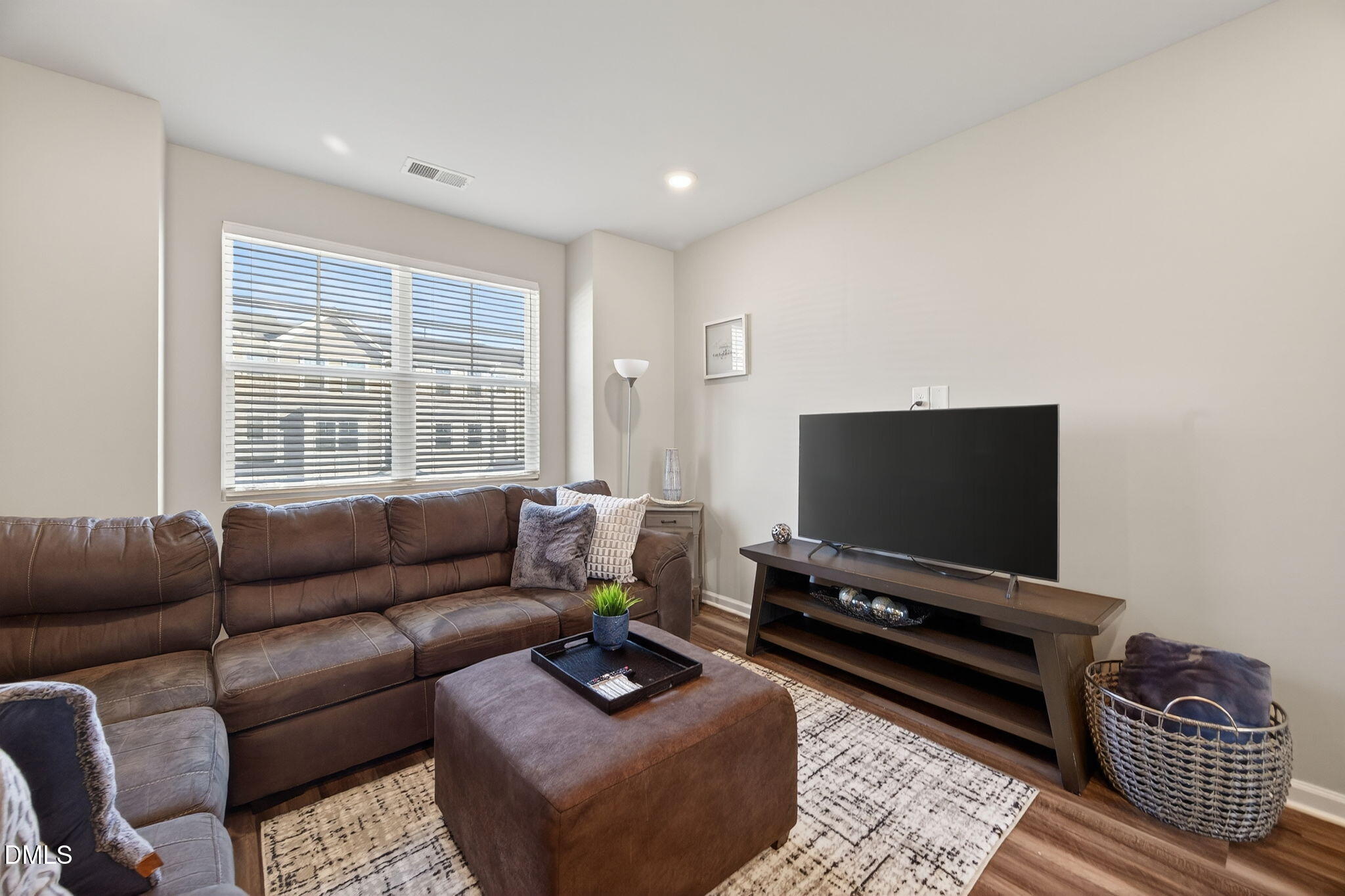 1063 Shoreside Drive Durham, NC 27713 - Photo 10 of 35 a living room with furniture and a flat screen tv