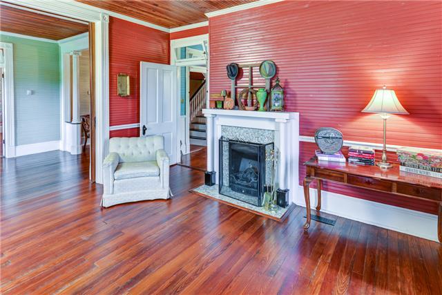 31 Golden Hollow Road Kelso, TN 37348 - Photo 3 of 20 Double Marble Fireplace to Living Room and Dining Room