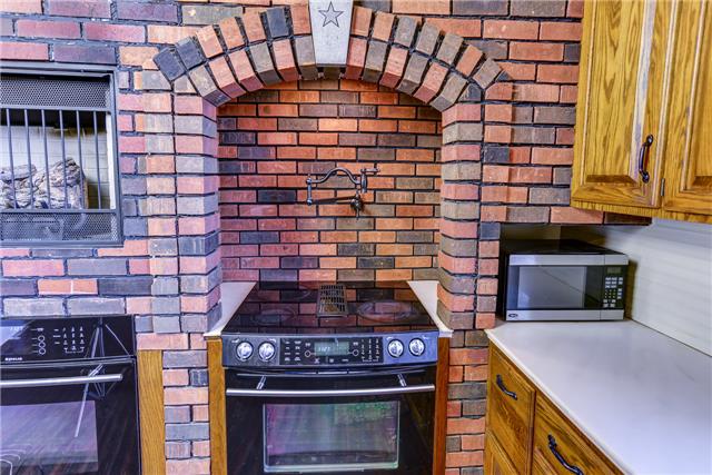 31 Golden Hollow Road Kelso, TN 37348 - Photo 8 of 20 Kitchen oven and fireplace