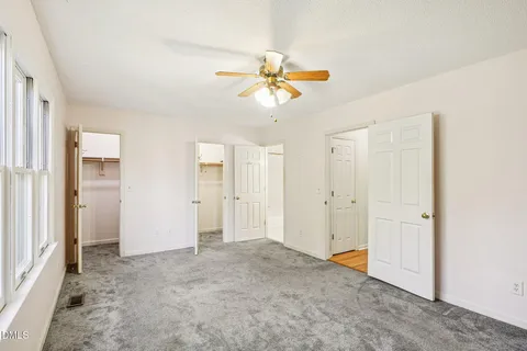 a view of a chandelier fan in a room