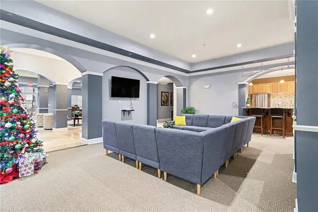 a living room with furniture and a large window