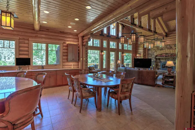 a view of a dining room with furniture window and outside view
