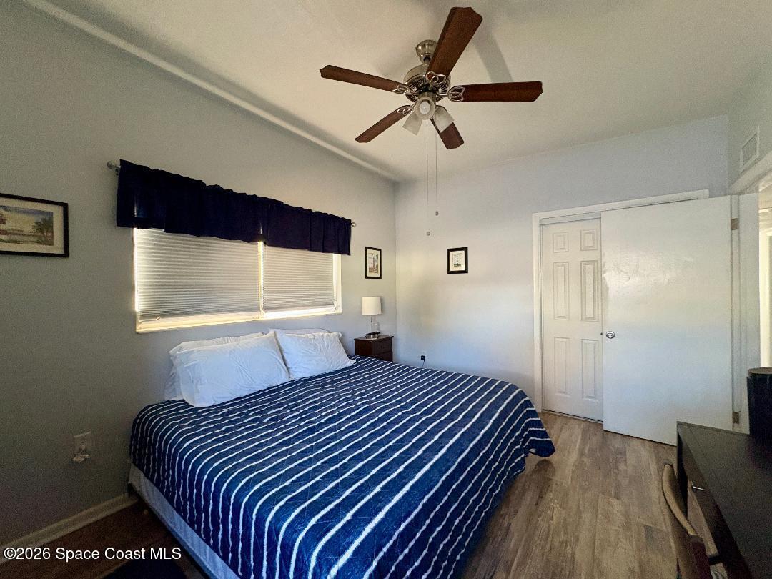 906 Santa Cruz Road Cocoa Beach, FL 32931 - Photo 15 of 24 a bedroom with a bed and window
