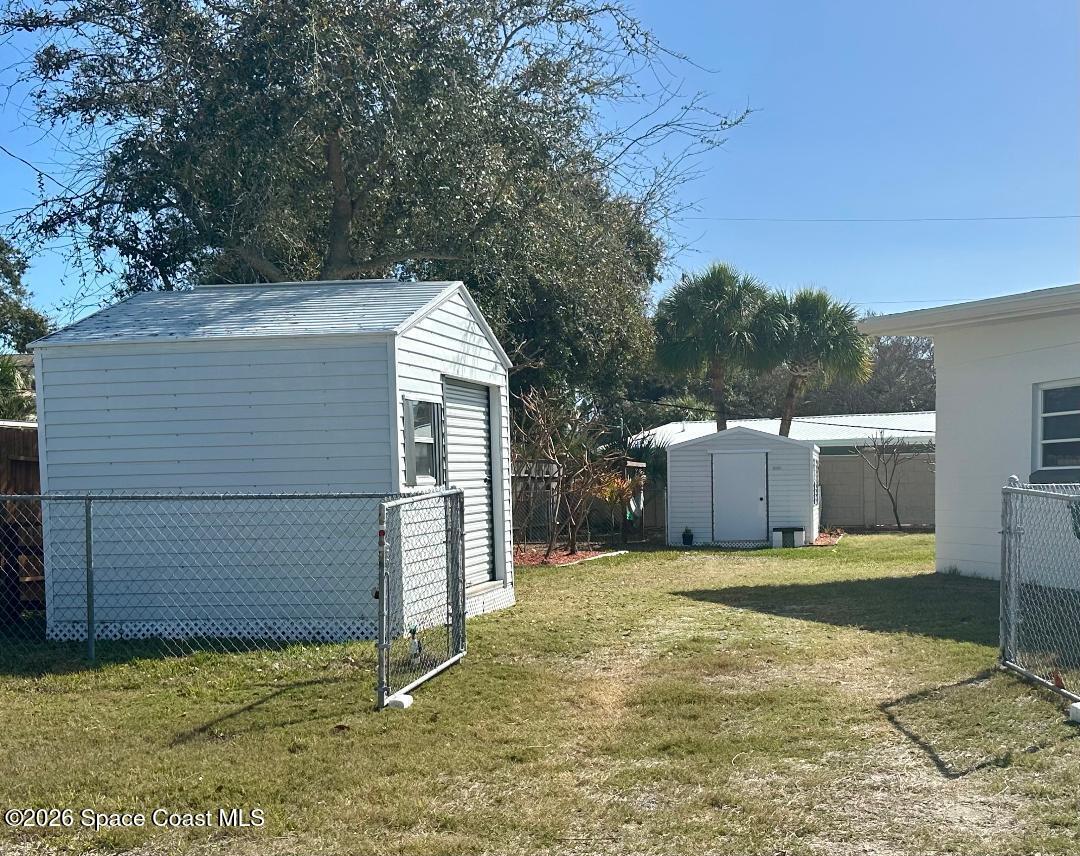 906 Santa Cruz Road Cocoa Beach, FL 32931 - Photo 20 of 24 a view of a backyard