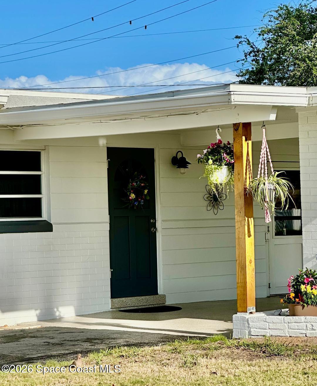 906 Santa Cruz Road Cocoa Beach, FL 32931 - Photo 2 of 24 Carport