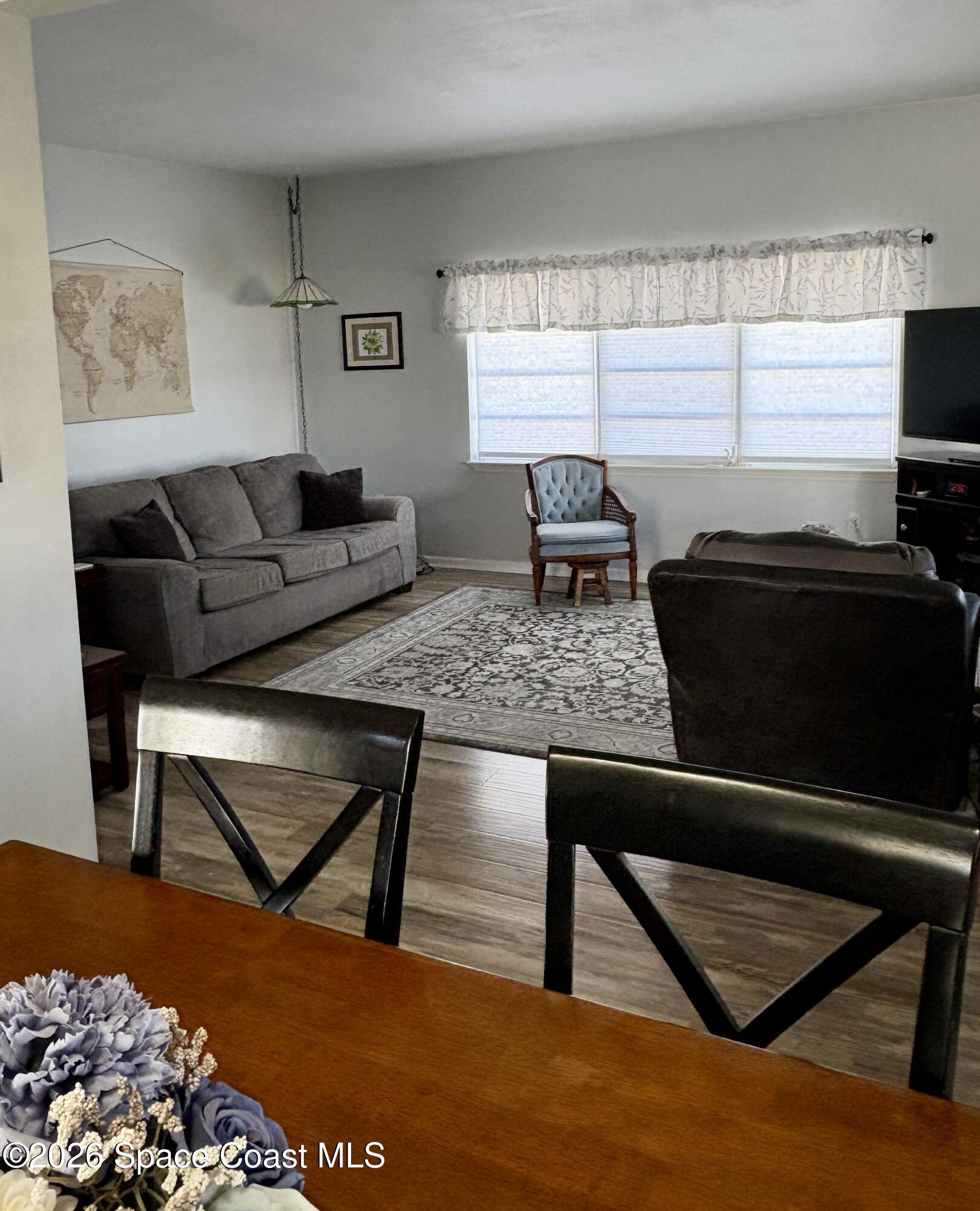 906 Santa Cruz Road Cocoa Beach, FL 32931 - Photo 8 of 24 a living room with furniture and a window