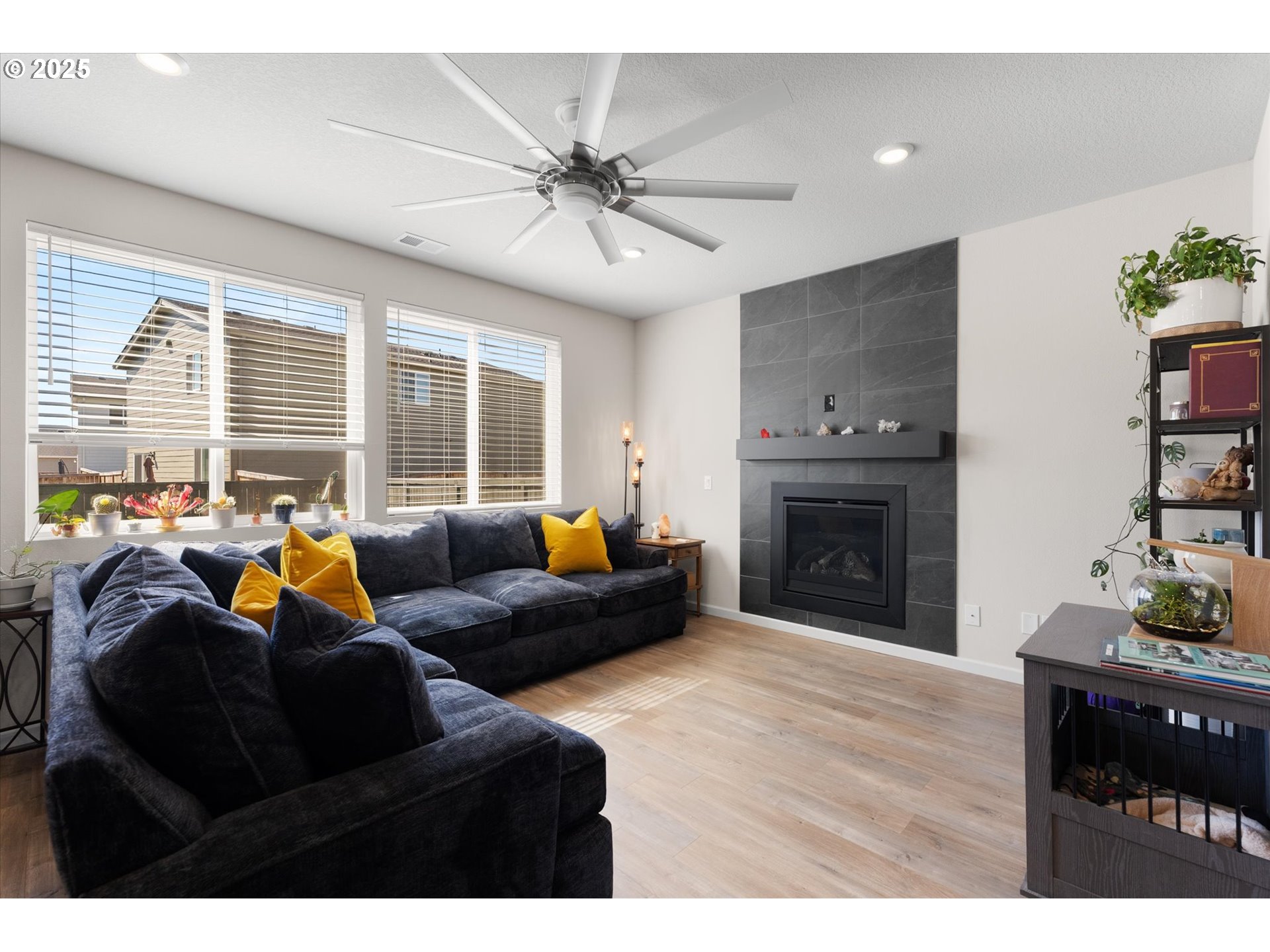 1906 Melody Way Longview, WA 98632 - Photo 8 of 39 a living room with furniture a fireplace and a flat screen tv