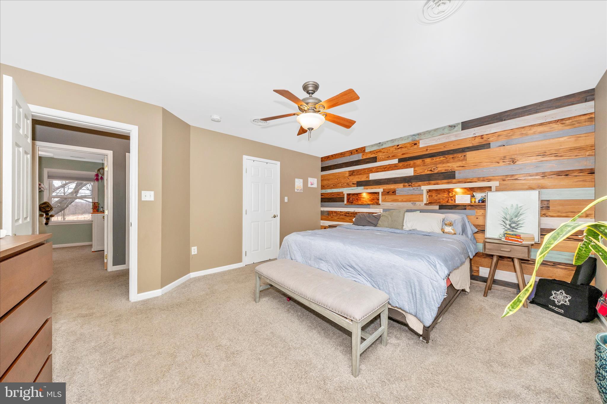4120 Petersville Road Knoxville, MD 21758 - Photo 22 of 52 a bedroom with a bed and a chandelier