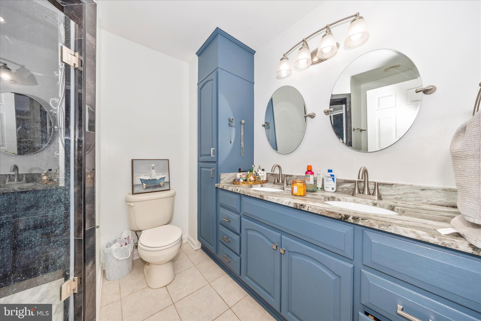 4120 Petersville Road Knoxville, MD 21758 - Photo 23 of 52 a bathroom with a double vanity sink mirror and toilet