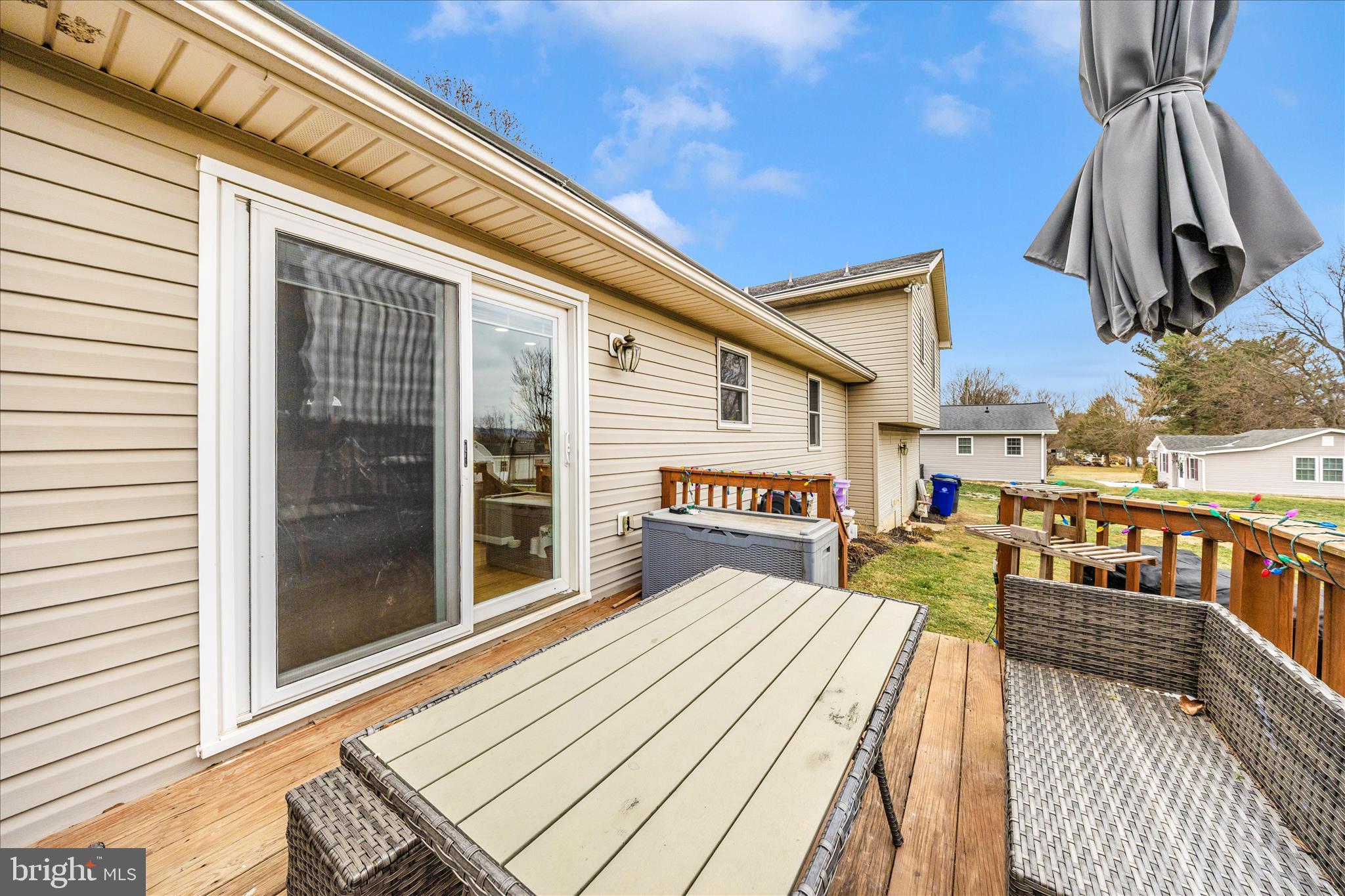 4120 Petersville Road Knoxville, MD 21758 - Photo 49 of 52 a view of a balcony with barbeque grill and wooden floor