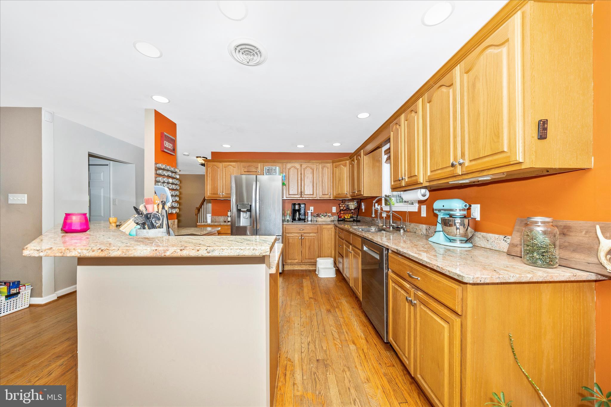 4120 Petersville Road Knoxville, MD 21758 - Photo 9 of 52 a kitchen with kitchen island granite countertop wooden cabinets a sink and dishwasher