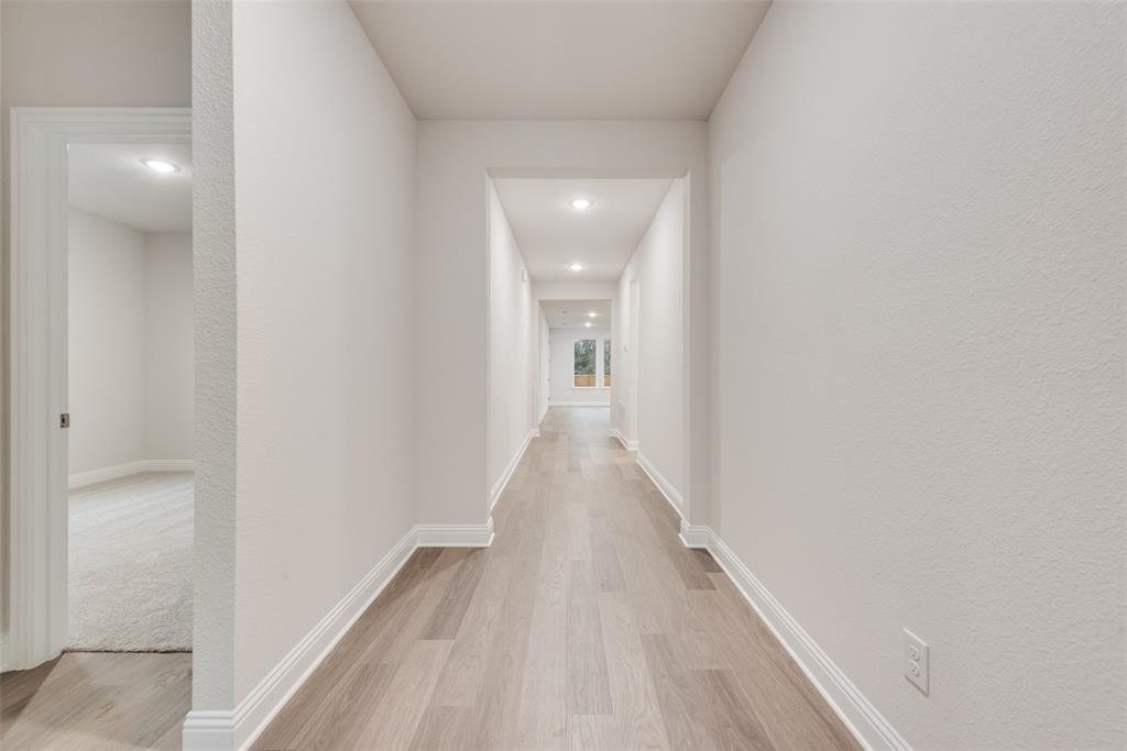 1013 Canoe Way Crowley, TX 76036 - Photo 10 of 26 a view of a hallway with wooden floor
