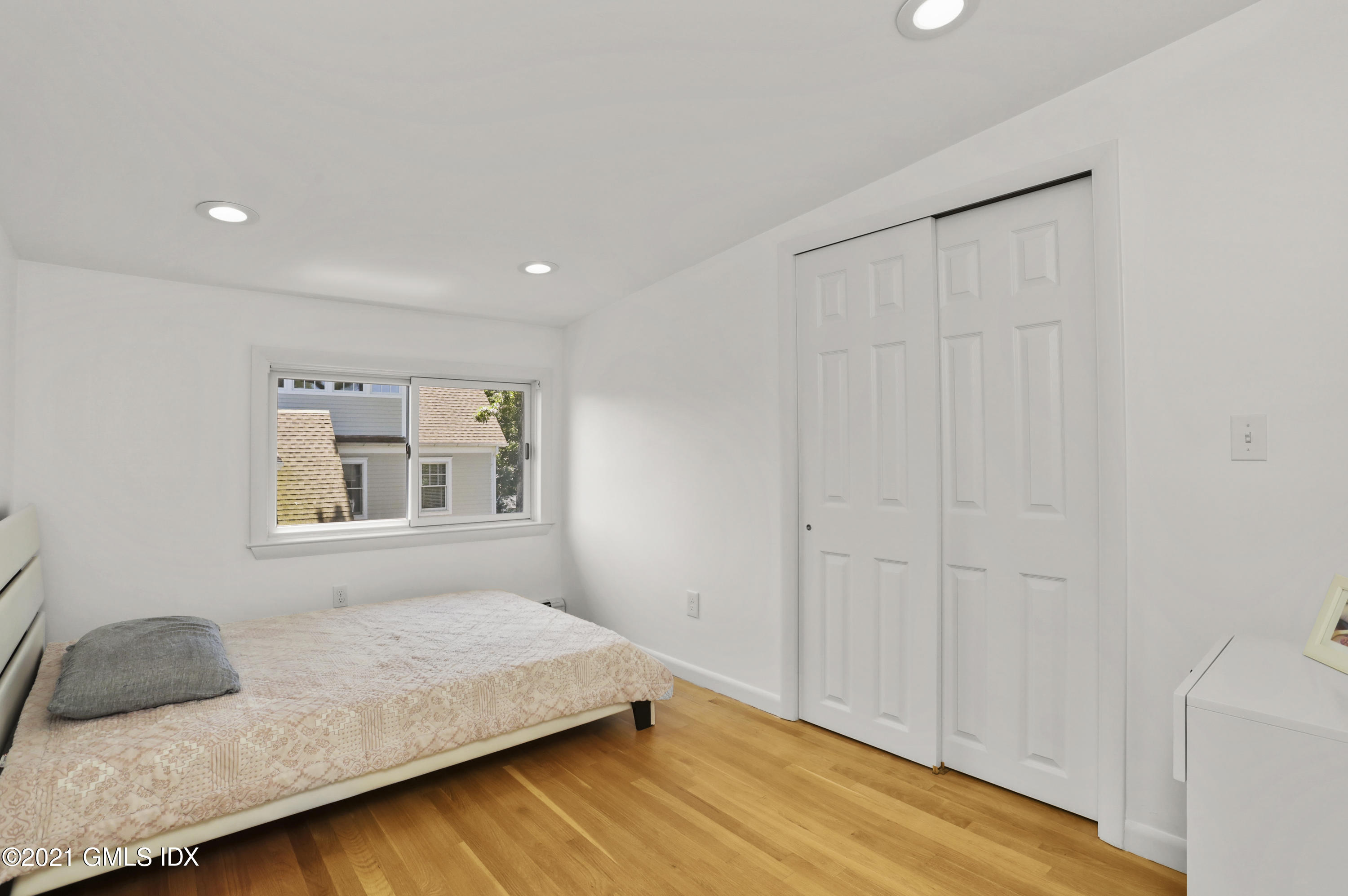 10 Ridge Road Cos Cob, CT 06807 - Photo 11 of 23 a bedroom with a bed and a couch