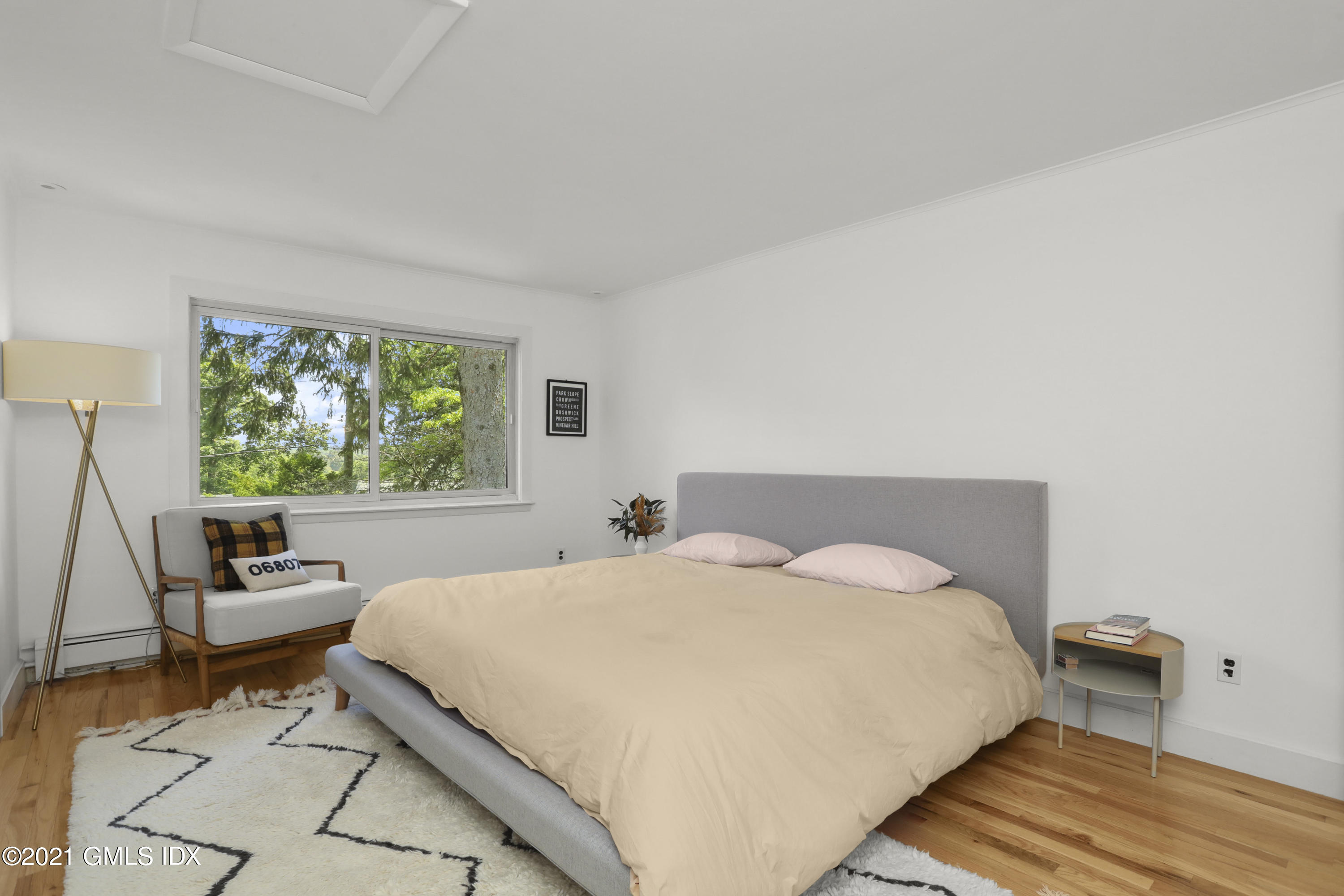 10 Ridge Road Cos Cob, CT 06807 - Photo 13 of 23 a bedroom with a bed and a large window