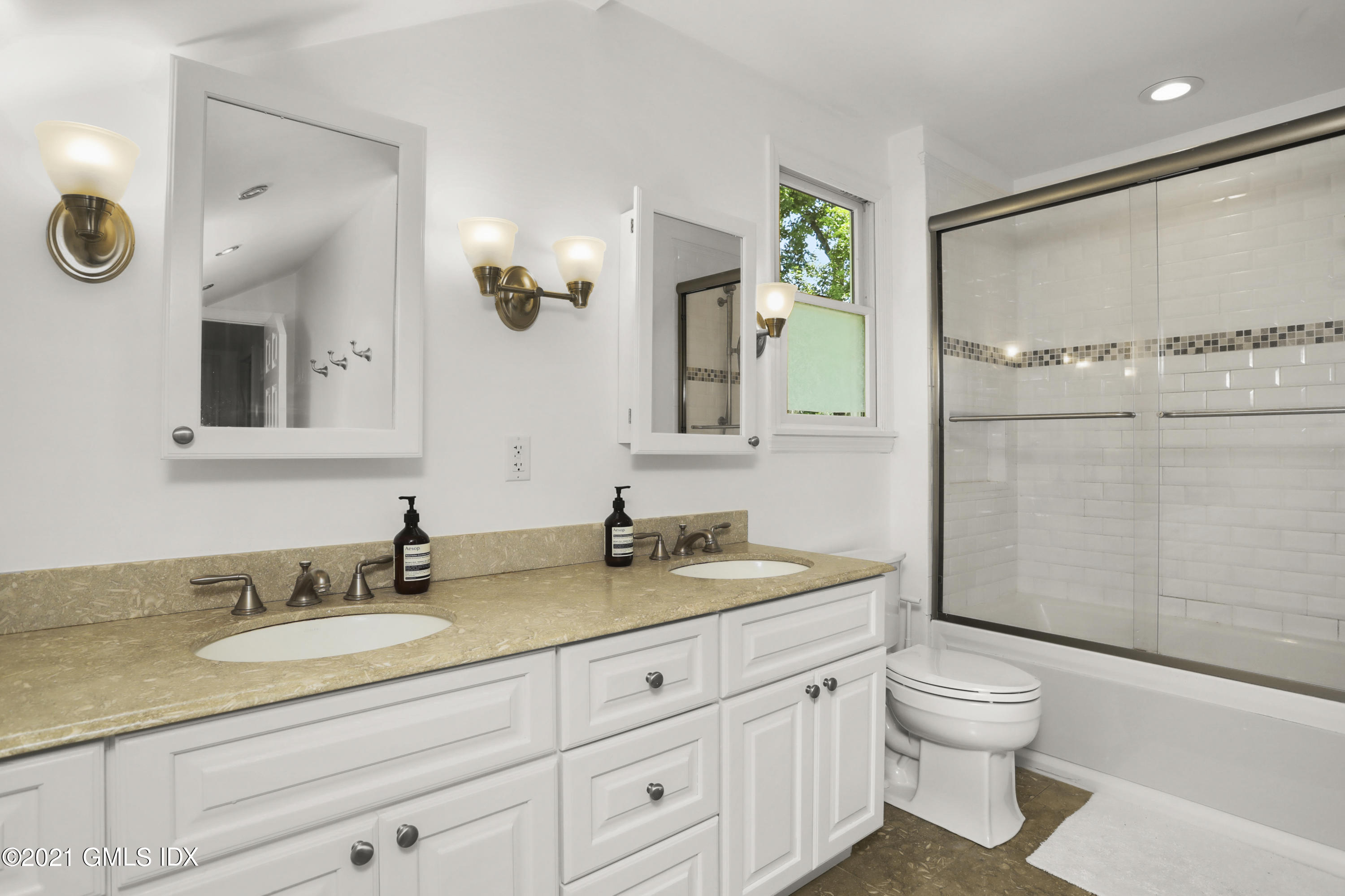 10 Ridge Road Cos Cob, CT 06807 - Photo 14 of 23 a bathroom with a granite countertop sink toilet and shower