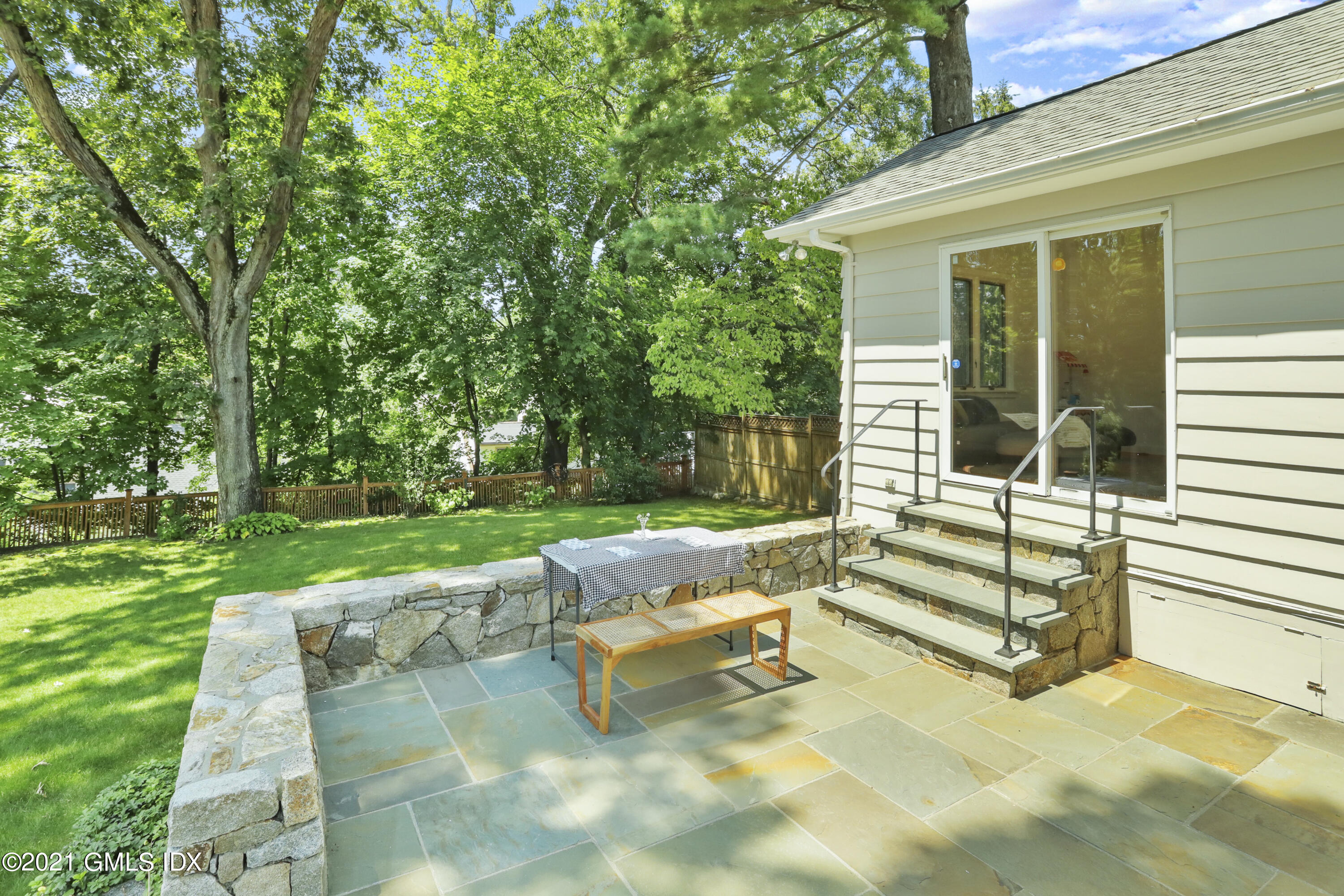 10 Ridge Road Cos Cob, CT 06807 - Photo 16 of 23 a view of a bench in the garden