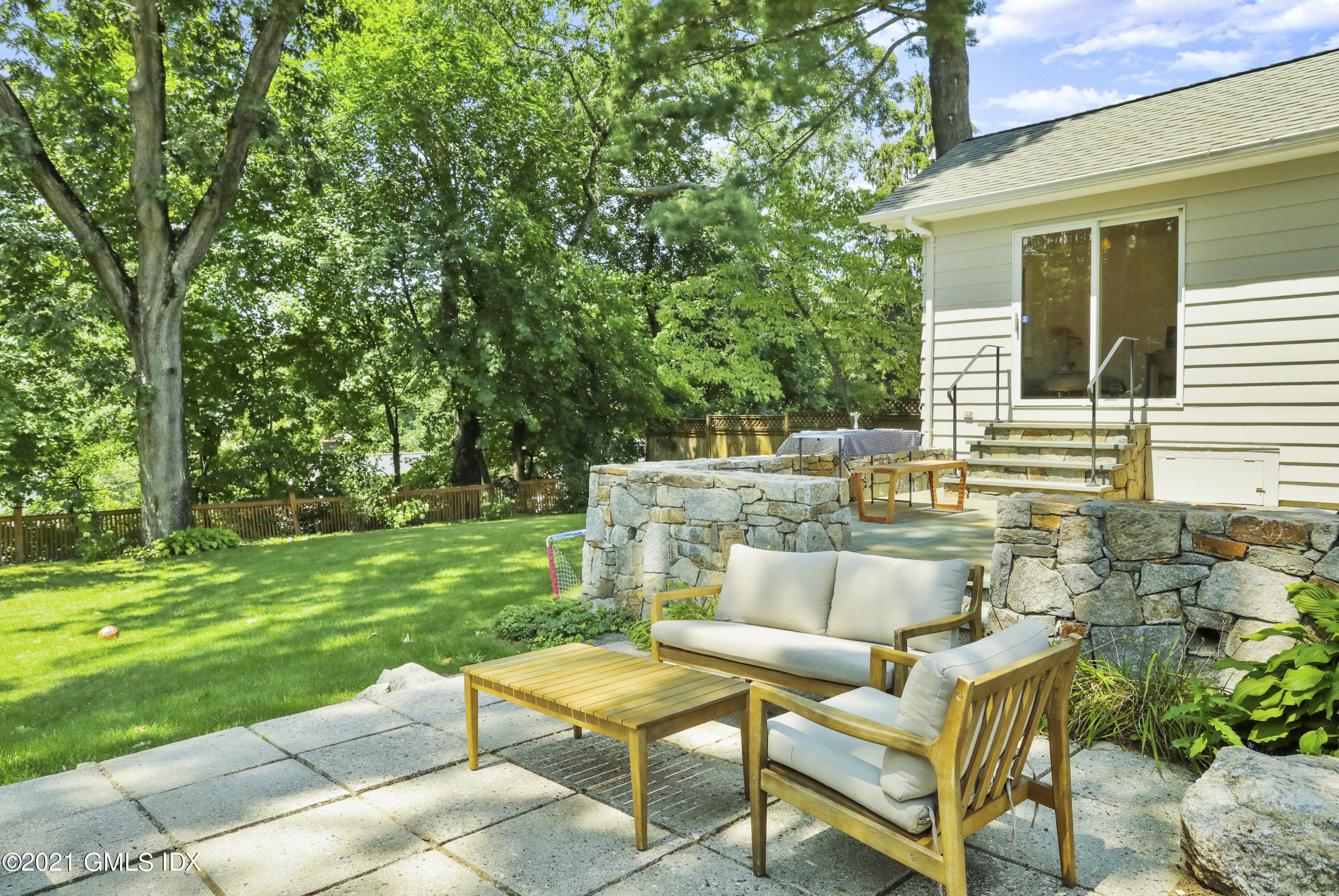 10 Ridge Road Cos Cob, CT 06807 - Photo 17 of 23 a view of a backyard with sitting area