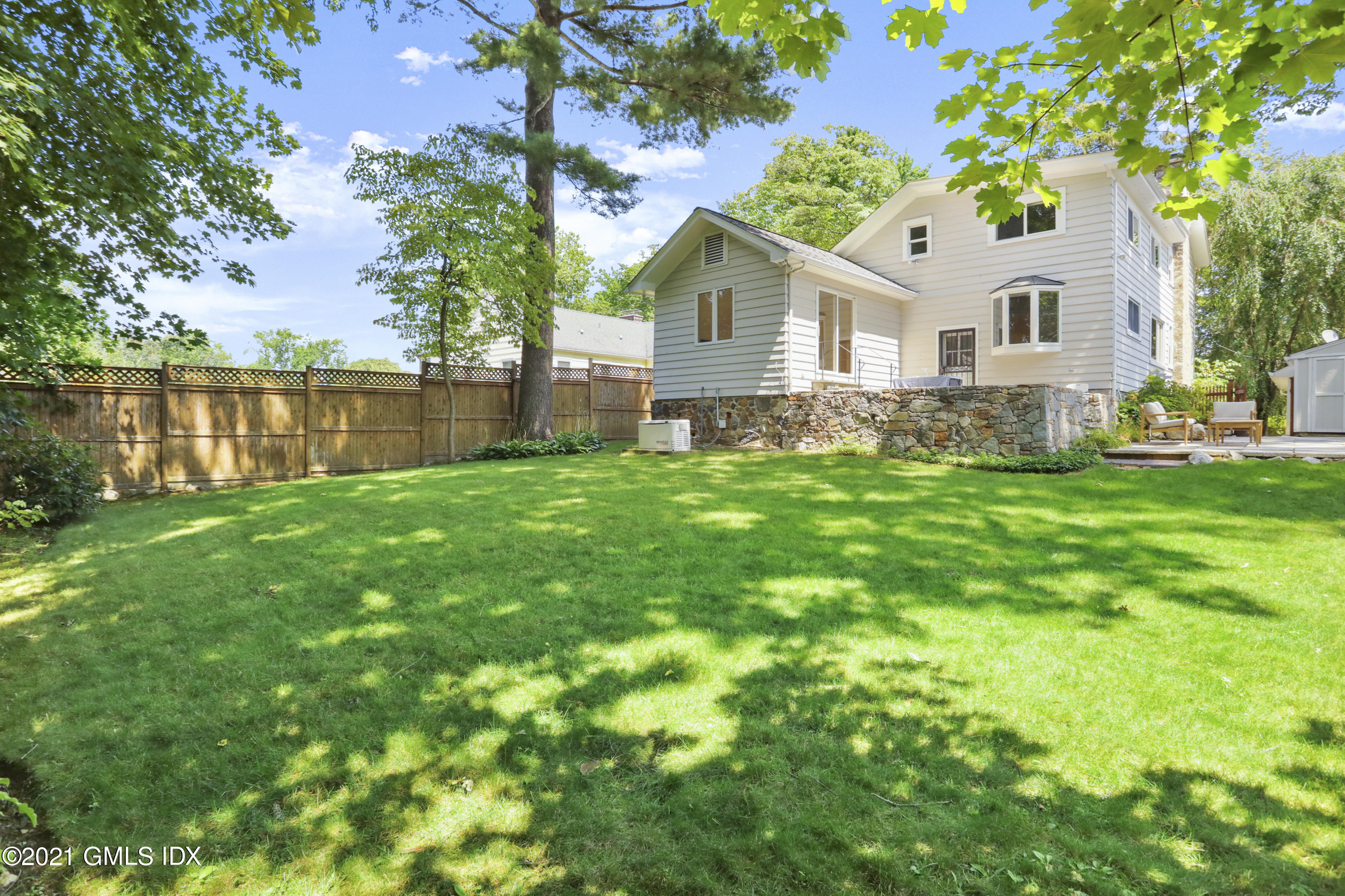 10 Ridge Road Cos Cob, CT 06807 - Photo 18 of 23 a view of a house with a yard and sitting area