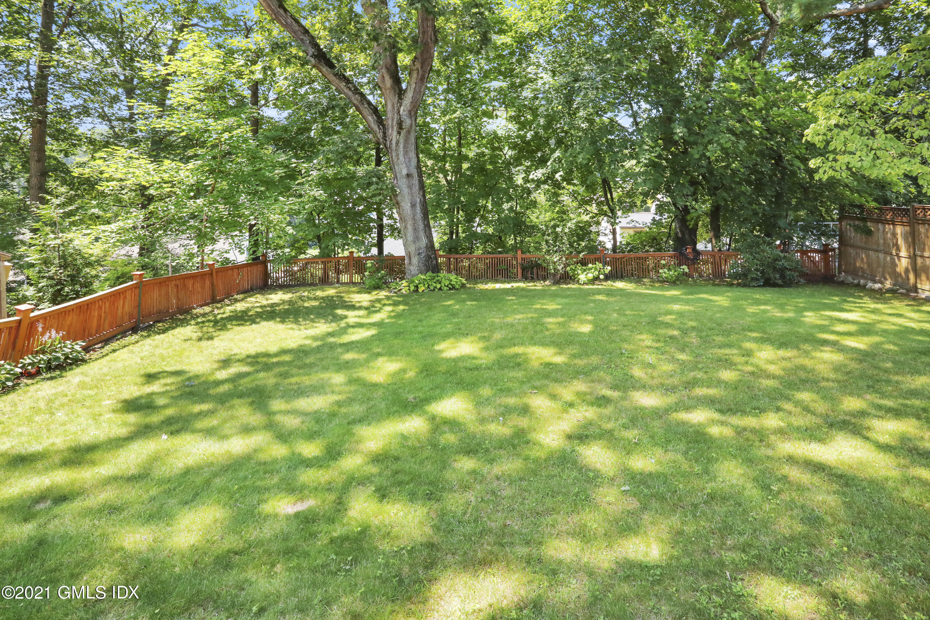 10 Ridge Road Cos Cob, CT 06807 - Photo 19 of 23 a view of outdoor space with deck and tree