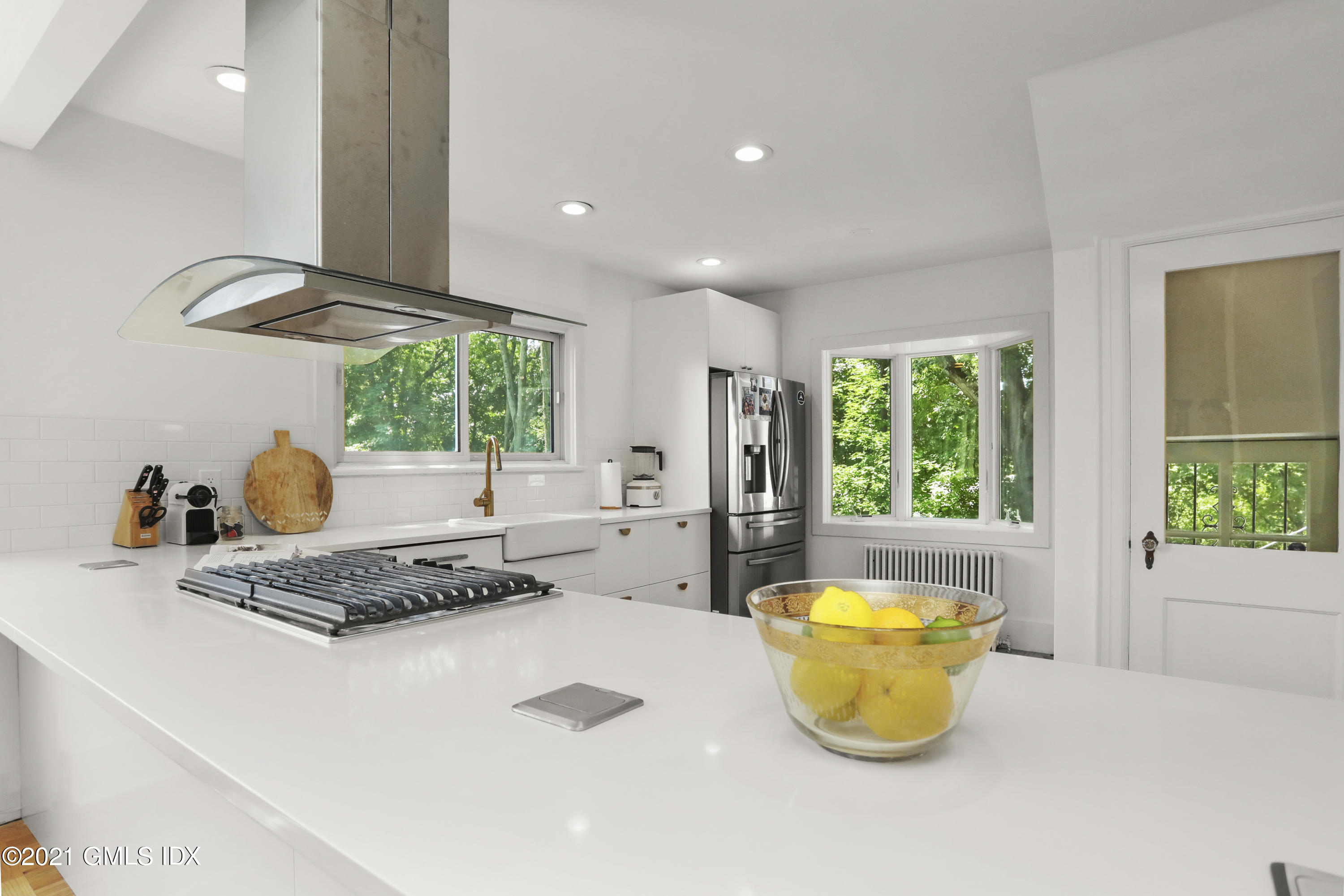 10 Ridge Road Cos Cob, CT 06807 - Photo 8 of 23 a kitchen with a table and a stove top oven