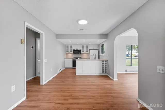 a view of kitchen with wooden floor