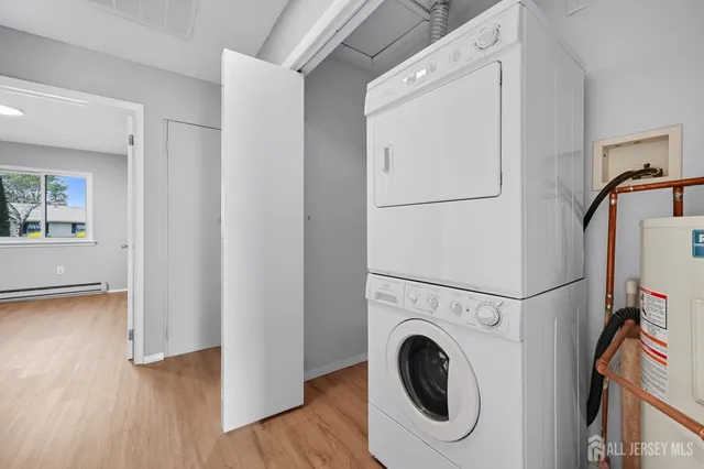 a view of a storage & utility room with washer and dryer