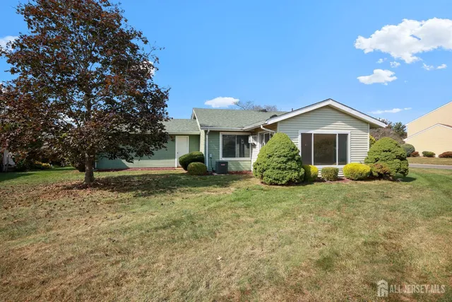 a view of a house with a backyard