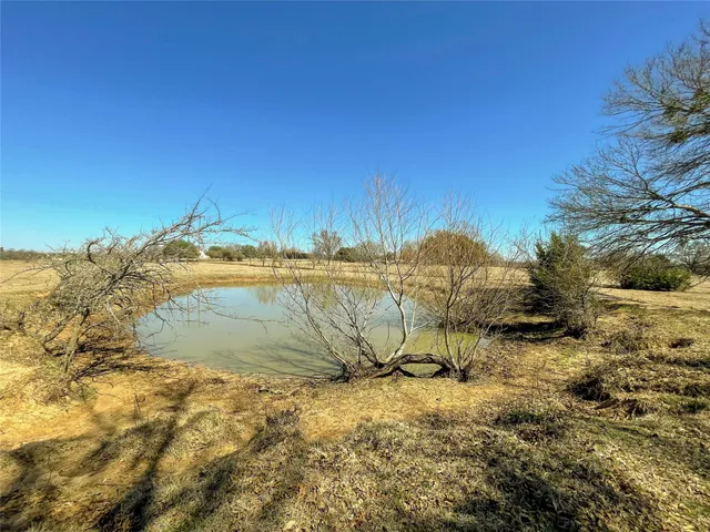 a view of a lake with a yard