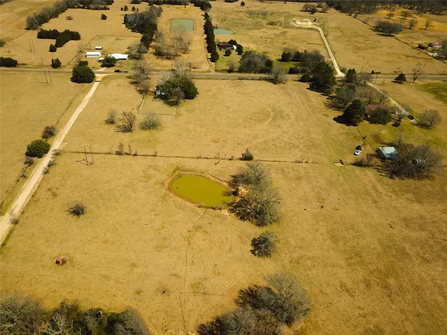 a living room with furniture and large windows