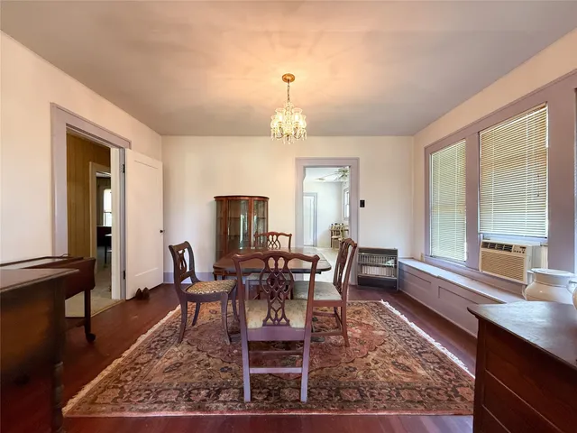 a large white kitchen with cabinets