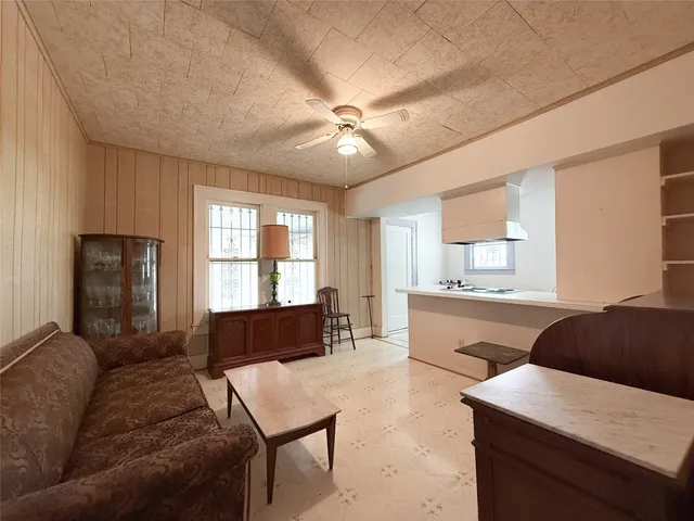 a bedroom with furniture and windows