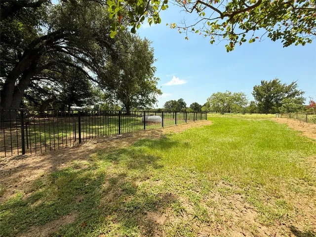 a view of a lake with a big yard