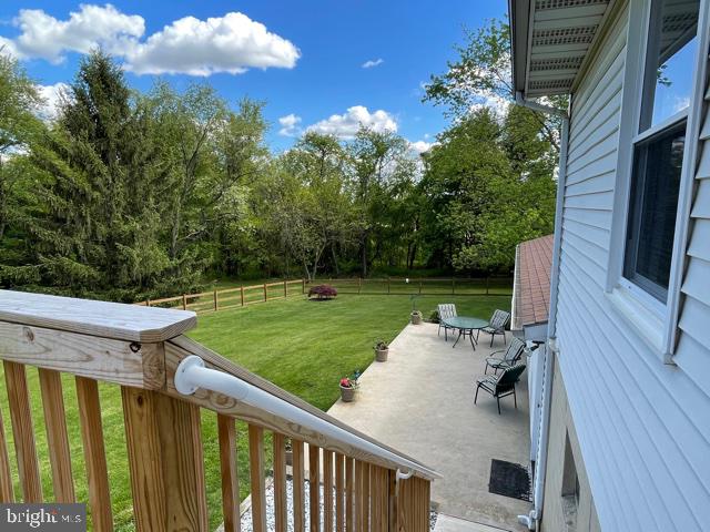 2539 Bert Fowler Road Hampstead, MD 21074 - Photo 23 of 65 Deck with Stairs to Patio and Fenced Yard