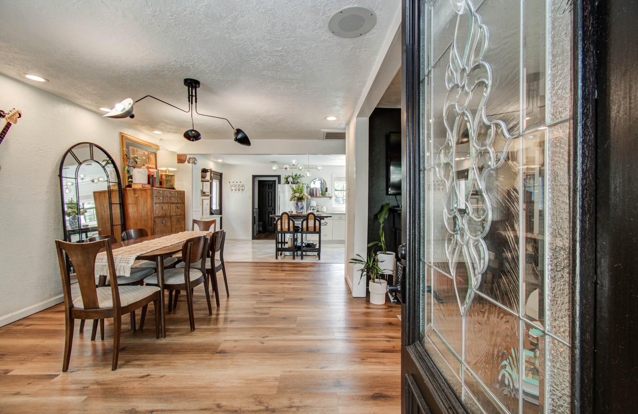 1612 East Bonner Street Houston, TX 77007 - Photo 4 of 30 a view of a dining room with furniture and a chandelier