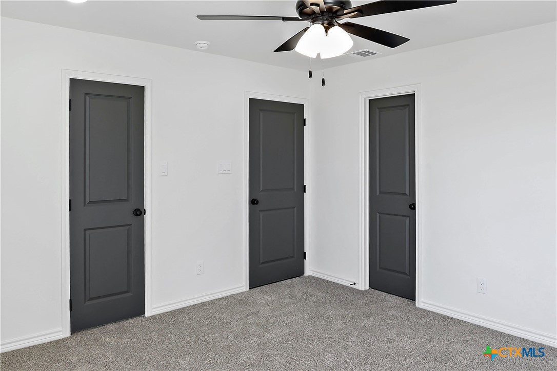1408 Rita Blanca Court Temple, TX 76502 - Photo 13 of 17 an empty room with closet and a chandelier fan
