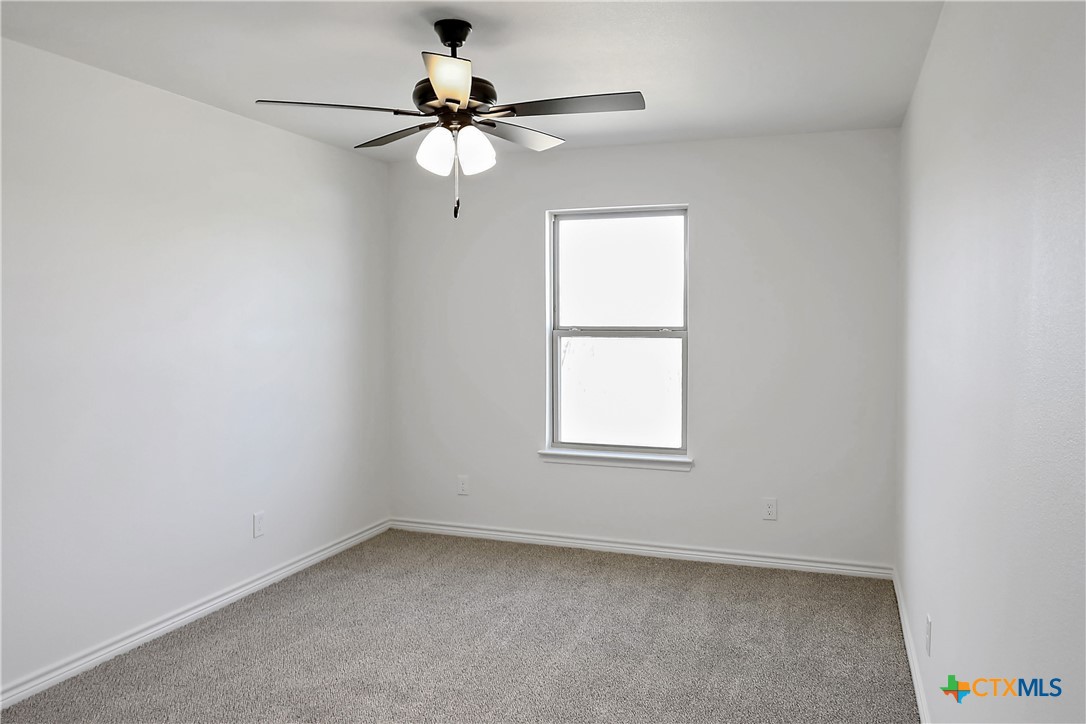 1408 Rita Blanca Court Temple, TX 76502 - Photo 10 of 17 an empty room with a window and a fan