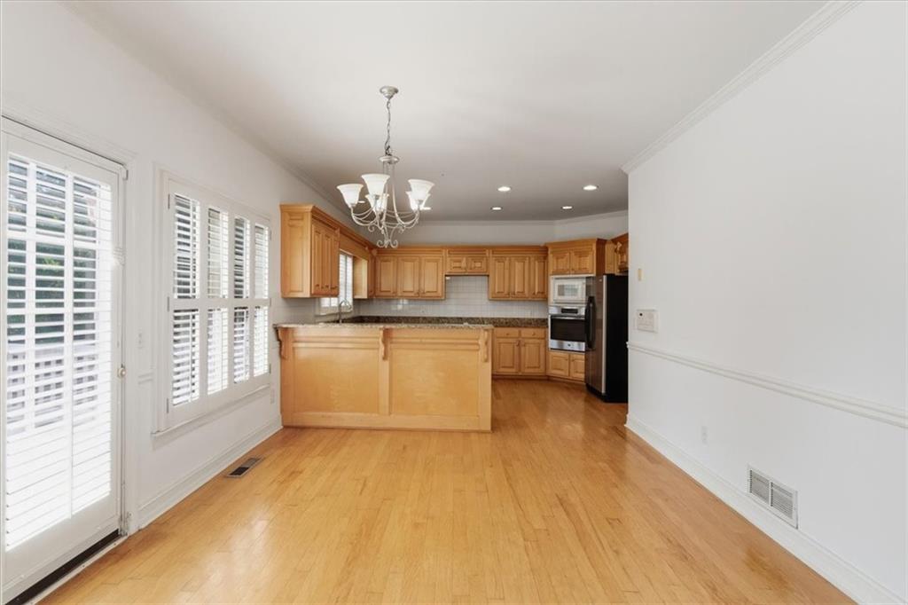 2021 Cockrell Pointe Northwest Kennesaw, GA 30152 - Photo 16 of 59 a view of a kitchen with a sink and a window